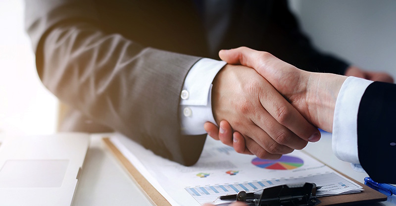 A firm handshake after financing a car